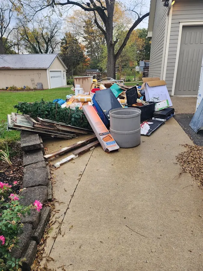 Dumpster being loaded with debris for 3 Yard Dumpster Rental in Hawaiian Ocean View